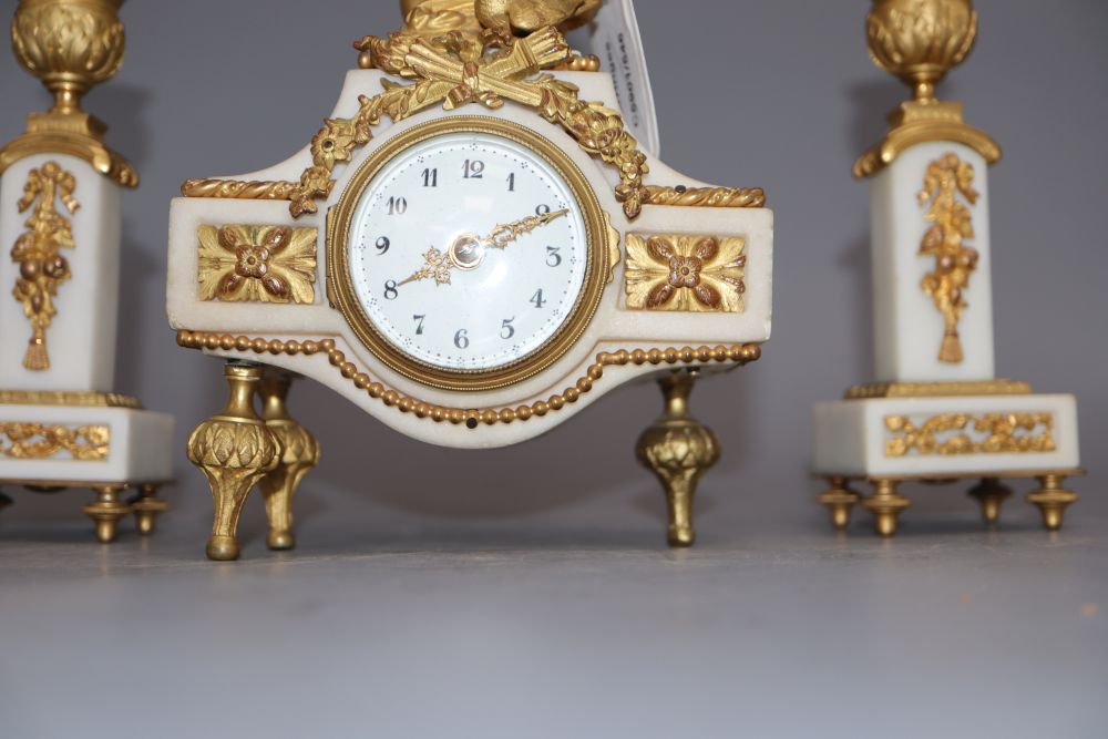 A 19th century ormolu clock garniture, with angelic surmount